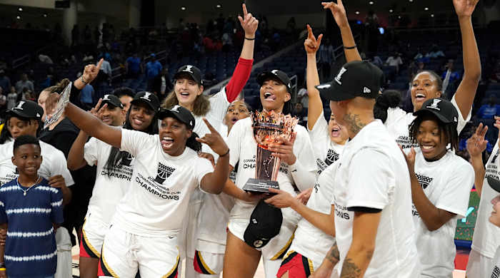 The Las Vegas Aces celebrate after winning the 2022 Commissioner’s Cup.